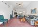 Living room with couches, coffee table, and pink carpeting at 201 Steamboat Blvd, Davenport, FL 33897