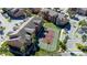 Aerial view of community buildings, tennis courts, and parking areas at 2218 Grand Cayman Ct # 1335, Kissimmee, FL 34741