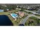 Aerial view of community pool, clubhouse, and surrounding buildings at 2218 Grand Cayman Ct # 1335, Kissimmee, FL 34741