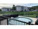 Relaxing community hot tub with surrounding fence and landscaping at 2218 Grand Cayman Ct # 1335, Kissimmee, FL 34741