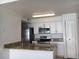 Modern kitchen featuring stainless steel appliances and granite countertops at 2218 Grand Cayman Ct # 1335, Kissimmee, FL 34741