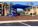 playground with swings and play structure at 2218 Grand Cayman Ct # 1335, Kissimmee, FL 34741