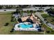 Community pool and spa with surrounding lounge chairs at 2218 Grand Cayman Ct # 1335, Kissimmee, FL 34741