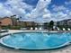 Relaxing community pool with lake views at 2218 Grand Cayman Ct # 1335, Kissimmee, FL 34741