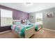 Bedroom with two twin beds, purple walls, and window at 2950 Buccaneer Palm Rd, Kissimmee, FL 34747