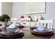 Table set for a dinner party with blue and white plates at 2950 Buccaneer Palm Rd, Kissimmee, FL 34747
