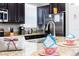 Kitchen island with breakfast bar and stylish decor at 2950 Buccaneer Palm Rd, Kissimmee, FL 34747