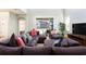 Spacious living room with sectional sofa and large TV at 2950 Buccaneer Palm Rd, Kissimmee, FL 34747