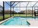 Screened-in pool with a view of the neighborhood at 2950 Buccaneer Palm Rd, Kissimmee, FL 34747