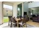 Screened patio with outdoor seating and view of neighborhood at 2950 Buccaneer Palm Rd, Kissimmee, FL 34747