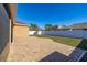 Spacious backyard with brick pavers and grassy area at 3061 Palermo Rose Way, Kissimmee, FL 34746