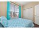 Spacious bedroom with a full bed and closet at 3061 Palermo Rose Way, Kissimmee, FL 34746