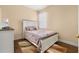 Cozy bedroom with a double bed and wood flooring at 3061 Palermo Rose Way, Kissimmee, FL 34746