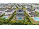 Aerial view showcasing a house with a pool and spa, surrounded by other homes at 370 Burma St, Kissimmee, FL 34747