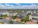 Two-story green house with brick driveway, nestled in a community at 370 Burma St, Kissimmee, FL 34747
