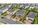 Green house with pool and landscaped yard, aerial view at 370 Burma St, Kissimmee, FL 34747