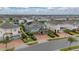 Green house with pool in a community of similar houses at 370 Burma St, Kissimmee, FL 34747