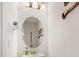 Small bathroom with round mirror and pedestal sink at 370 Burma St, Kissimmee, FL 34747