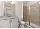 Bathroom with shower, toilet and vanity with granite countertop at 370 Burma St, Kissimmee, FL 34747