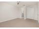 Spacious bedroom with carpeted floors and ceiling fan at 370 Burma St, Kissimmee, FL 34747