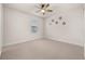 Bright bedroom with carpeted floor and ceiling fan at 370 Burma St, Kissimmee, FL 34747