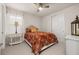 Bedroom with a full bed and ceiling fan at 370 Burma St, Kissimmee, FL 34747