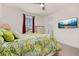 Bedroom with a full bed and mounted TV at 370 Burma St, Kissimmee, FL 34747