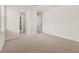 Well-lit bedroom with carpet and access to a bathroom at 370 Burma St, Kissimmee, FL 34747