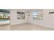 Room overlooking pool with view through sliding glass doors at 370 Burma St, Kissimmee, FL 34747