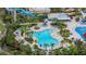 Relaxing freeform pool with surrounding lounge chairs at 370 Burma St, Kissimmee, FL 34747