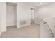Hallway with carpeted floors and access to bedrooms at 370 Burma St, Kissimmee, FL 34747