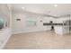 Bright kitchen with white cabinets, stainless steel appliances, and tile flooring at 370 Burma St, Kissimmee, FL 34747