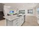 Modern kitchen with white cabinets, granite countertops, and stainless steel appliances at 370 Burma St, Kissimmee, FL 34747