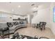 Spacious living room with curved sofa and large TV at 370 Burma St, Kissimmee, FL 34747
