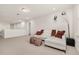 Relaxing loft area with sectional sofa and ottomans at 370 Burma St, Kissimmee, FL 34747
