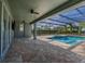 Inviting screened pool and spa with spacious paver patio at 370 Burma St, Kissimmee, FL 34747