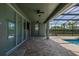 Inviting screened pool and spa with spacious paver patio at 370 Burma St, Kissimmee, FL 34747