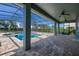 Inviting screened pool and spa with spacious paver patio at 370 Burma St, Kissimmee, FL 34747