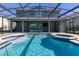 This home features a beautiful screened pool and spa at 370 Burma St, Kissimmee, FL 34747