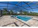 Inviting screened pool and spa with paver deck at 370 Burma St, Kissimmee, FL 34747