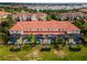 Aerial view highlighting a row of townhouses with individual screened pools at 4723 Terrasonesta Dr, Davenport, FL 33837