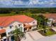 Two-story home with tile roof and driveway at 4723 Terrasonesta Dr, Davenport, FL 33837