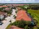 Aerial view of a townhouse community showcasing multiple units and a pool at 4723 Terrasonesta Dr, Davenport, FL 33837