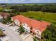 Aerial view showing townhouses, parking, and surrounding landscape at 4723 Terrasonesta Dr, Davenport, FL 33837