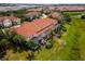 Aerial view of townhouses with private pools and a large green space at 4723 Terrasonesta Dr, Davenport, FL 33837