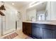 Bathroom with double vanity and walk-in shower at 4723 Terrasonesta Dr, Davenport, FL 33837
