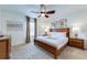 Bedroom with king-size bed and wood furniture at 4723 Terrasonesta Dr, Davenport, FL 33837
