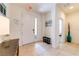 Bright and airy entryway with tile flooring and a bench at 4723 Terrasonesta Dr, Davenport, FL 33837