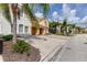 Townhome community with lush landscaping and palm trees at 4723 Terrasonesta Dr, Davenport, FL 33837