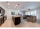 Open kitchen with island, stainless steel appliances, and breakfast bar at 4723 Terrasonesta Dr, Davenport, FL 33837